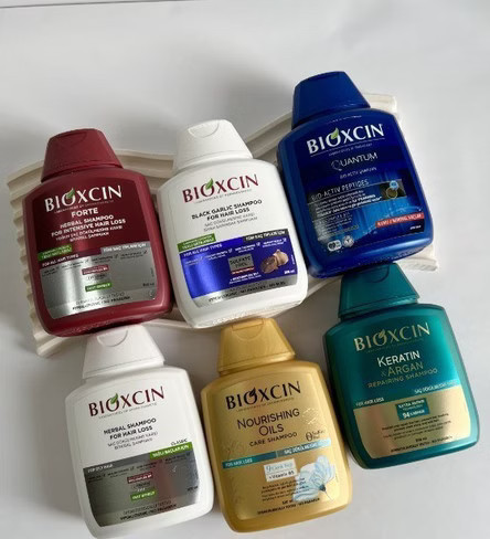 شامپو طلایی bioxسین مدل Nourishing Oils ، بدون سولفات حاوی 9 روغن مغذی ، مناسب برای موهای خشک و آسیب دیده ، با حجم 300 میلی(واردات قانونی از منطقه آزاد ارس)